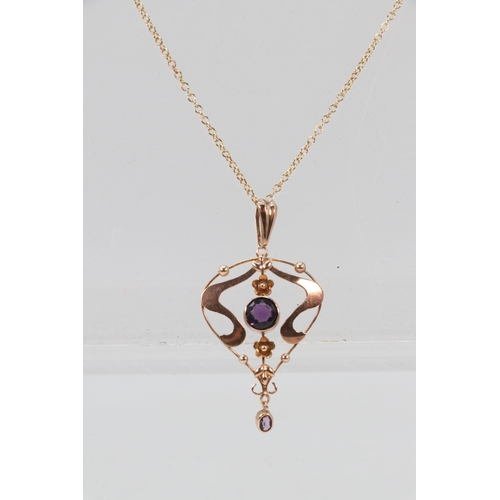 282B - 9ct Gold pendant and fine chain, with central Amethyst