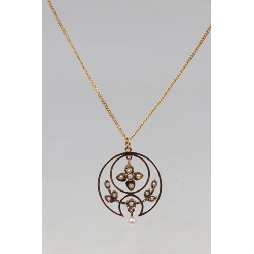 282C - 18ct gold fine and with circular pendant set with seed pearls