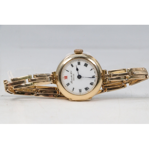 282E - 15ct gold ladies wristwatch with 15ct gold flexi strap