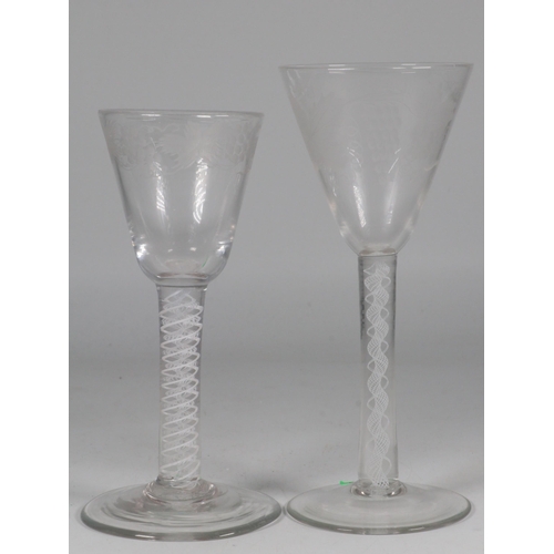 13 - Two antique engraved wine glasses with twist stems