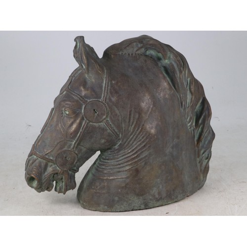 26 - Patinated bronzed finish sculpture in the form of a horses head measures approx. 31cm tall