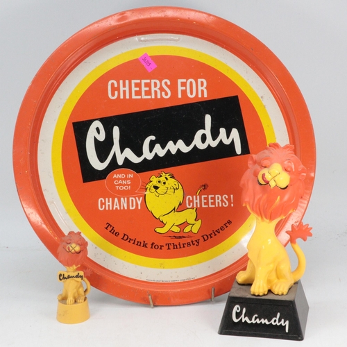 30 - A Chandy tin tray together with two advertising lion statues