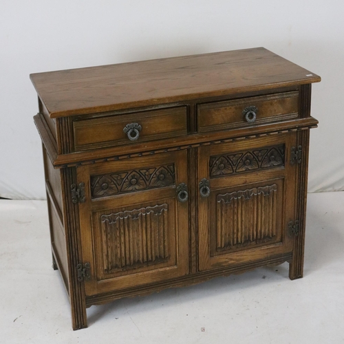 85 - Old Charm small side board with two cupboard doors, linen fold detail (top has water stains and scra... 