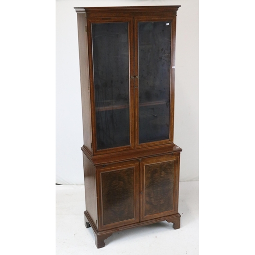 121 - Glazed bookcase over cupboard with writing slide measures approx. 71cmW x 36cmD x 177cmH