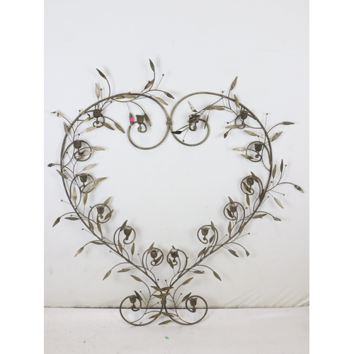 142 - Metal heart shaped wall mounted candelabra measures approx. 120cm tall