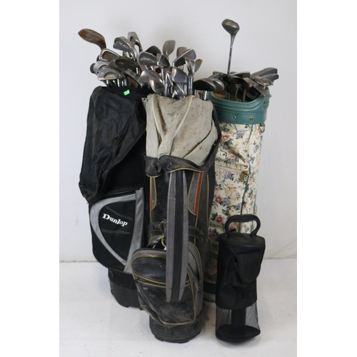 109 - Three golf bags of assorted golf clubs to include Dunlop, Ping, Lynx and a golf ball picker