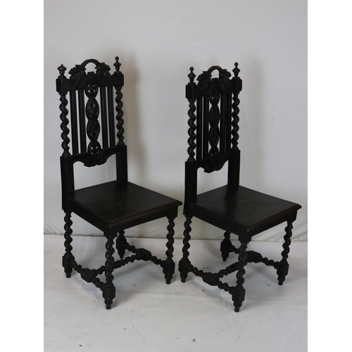 287 - Pair of heavily carved hall chairs