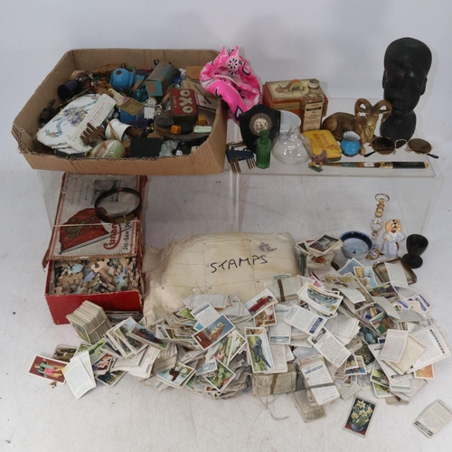 397 - Carton of collectables and curios to include tea cards, stamps, Cunard jigsaw puzzle