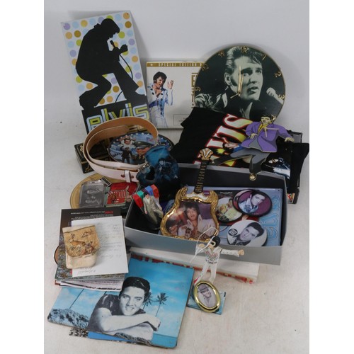 428 - Carton of assorted Elvis memorabilia including t-shirts, clocks etc