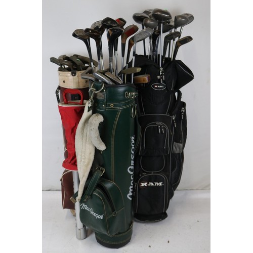449 - Three golf bags of assorted clubs together with a Masters ball collector to include Taylor made, Sla... 