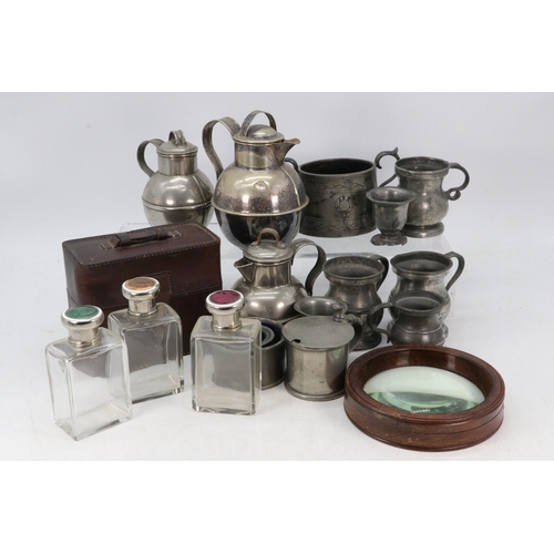 117 - Leather cased glass bottles all with enamel decorated tops (examine) together with with pewter measu... 