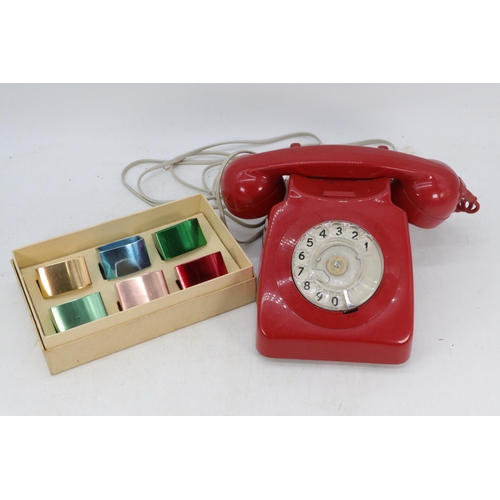 346 - Red cased rotary GPO telephone together with a set of Kaymet anodised napkin rings