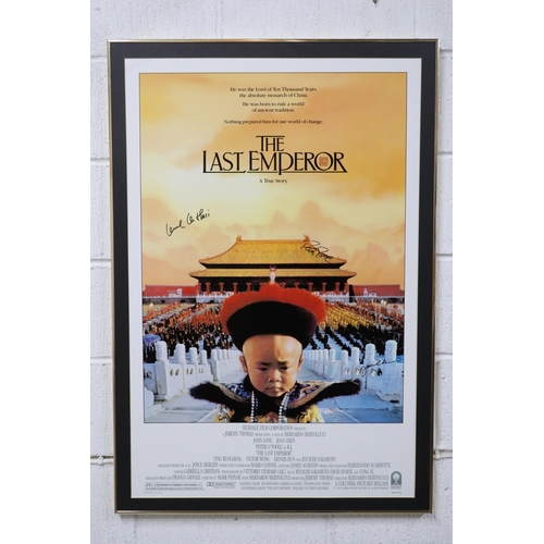 257 - A framed Last Emperor film posted, signed, with certificate, not glazed, measures approx. 65cm x 105... 