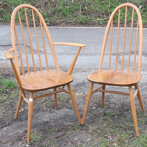 406 - Ercol extending dining table with fold out leaf stored under and fifth supporting leg together with ... 