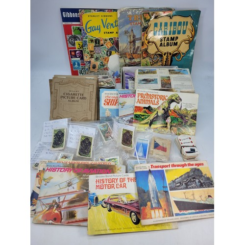 507 - Two boxes of assorted cigarette card, stamps assorted