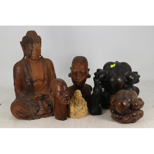 52 - A collection of wooden items to include Balinese Weeping Buddhas etc,,