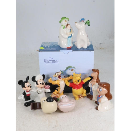 63 - A collection of Disney salt and pepper pots, together with a boxed Snowman and Snow dog set, Wallace... 