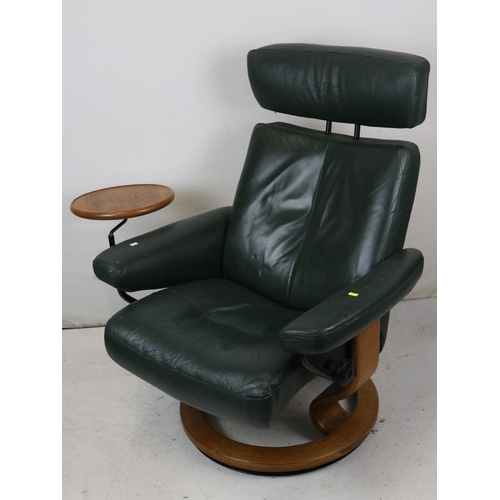 111 - An Ekornes Stressless recliner in green with side table.