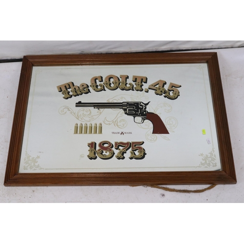 234 - A Colt 45 transfer print mirror measuring approx. 2' x 34