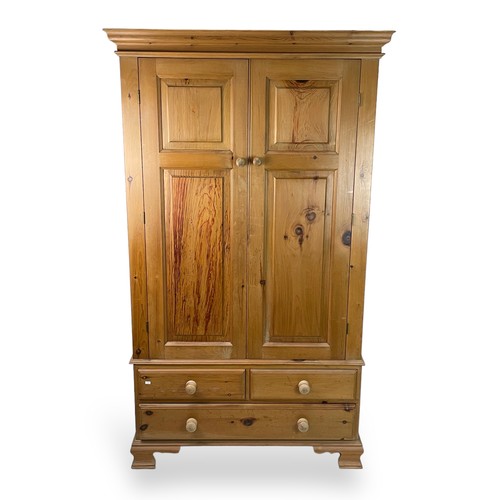 48 - Pine two door wardrobe, in two sections and a plinth top. approx. 110cm w x 190cm t x 58cm d