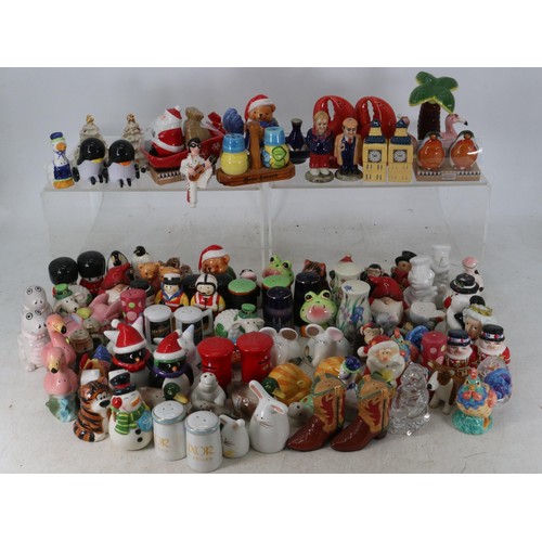 24 - A large collection of assorted novelty ceramic, glass and plastic salt & pepper pots. Villeroy & Boc... 