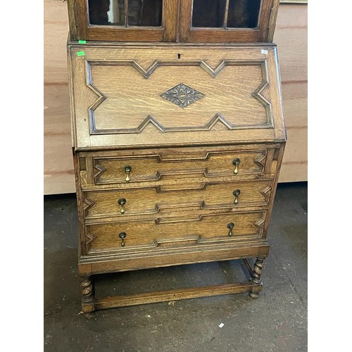 70 - An oak bureau with glazed bookcase above. It measures approx. 73w x 45d x 183cmh