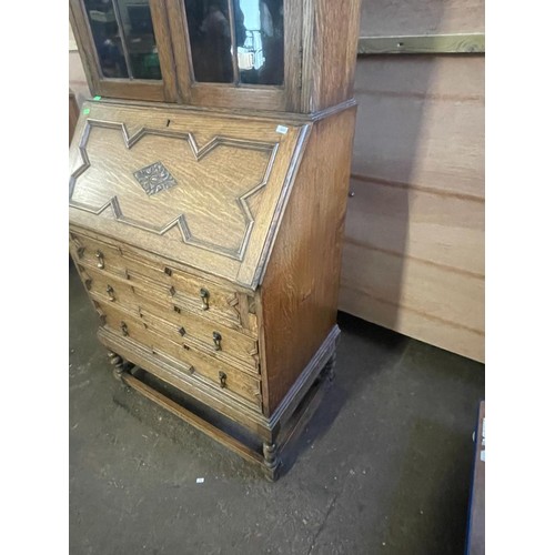 70 - An oak bureau with glazed bookcase above. It measures approx. 73w x 45d x 183cmh