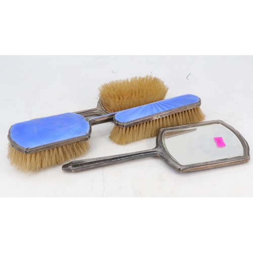 22 - Silver and enamel hair brushes and a mirror