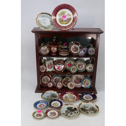 255 - Selection of decorative Limoges together with a display rack