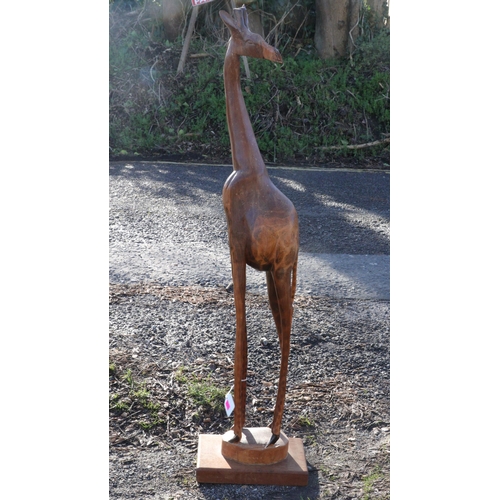 285 - Large floor standing carved wooden giraffe (approx. height 95cm)