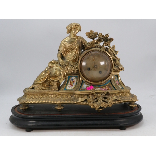 288 - Nichelant Paris gilt mantle clock inset with porcelain panels.