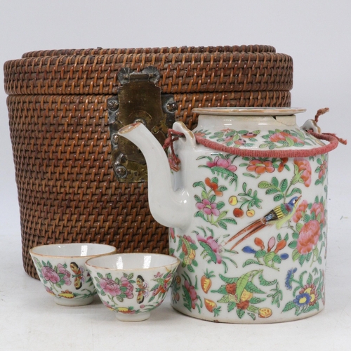 363 - Oriental Teapot and tea bowls in fitted Rattan case