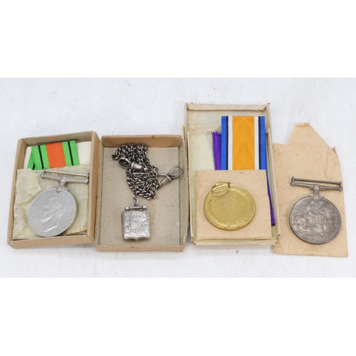 34 - WWI and WWII medals for Gnr A. G Richens RA boxes and papers together with silver watch chain and ph... 