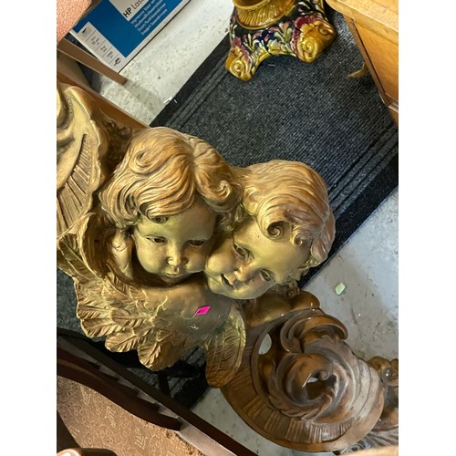 380 - Two Edwardian corner chairs and a gilt plaster wall cherub relief