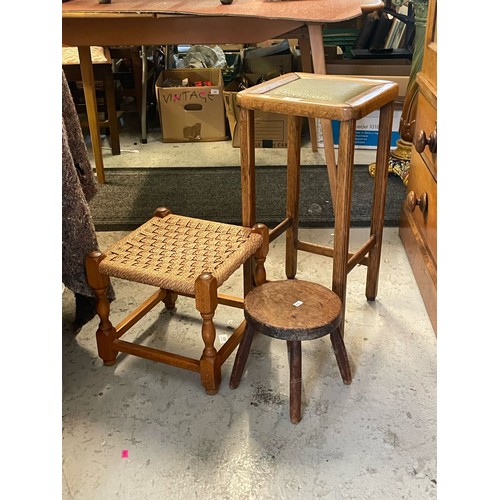 390 - A vintage oak stool, together with a milking stool and a woven topped stool