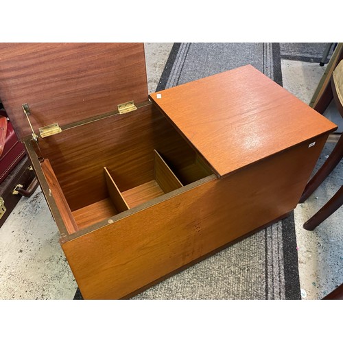 401 - A teak record/media storage box two opening lids, on castors