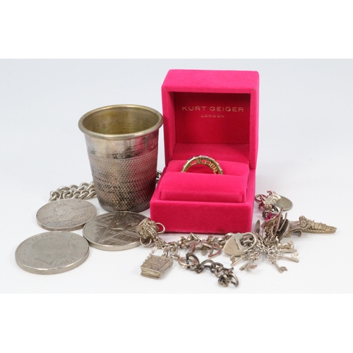 17A - Boxed Kurt Geiger dress ring together with a charm bracelet, oversize thimble, two £5 coins and a Qu... 