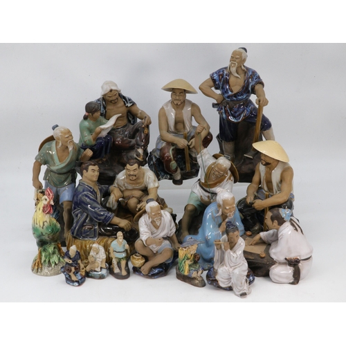 405 - A selection of Oriental clay figures