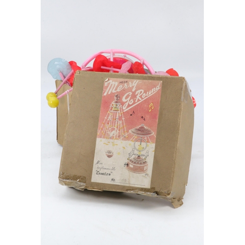 44 - Celluloid vintage TKR Japan mobile musical Merry Go-round complete with original box (showing wear) ... 