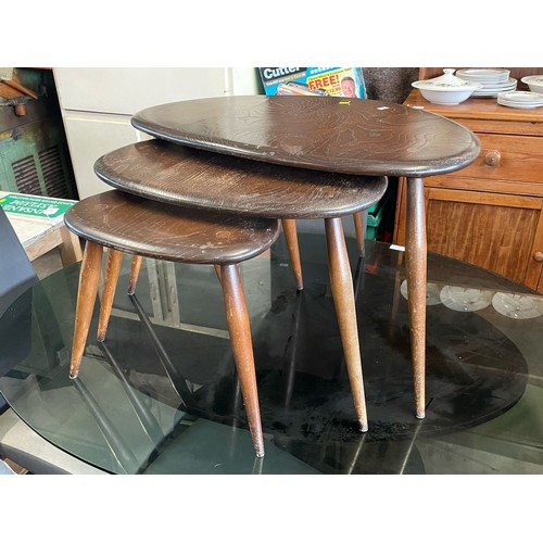 80 - Nest of three Ercol dark finish pebble tables.