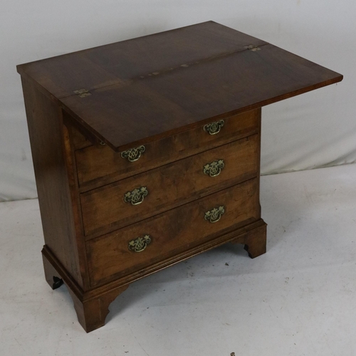 154 - Chest of drawers in walnut veneer with fold-over top. Measuring approx. 69w x 30d x 79cmh