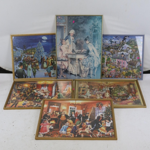 201 - 11 framed Jigsaw puzzles to included several Waddington's Christmas series etc