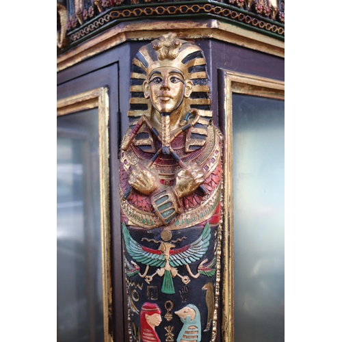 312 - A pair of display cabinets with lights,  over cupboards with Egyptian motifs. They measure approx 72... 