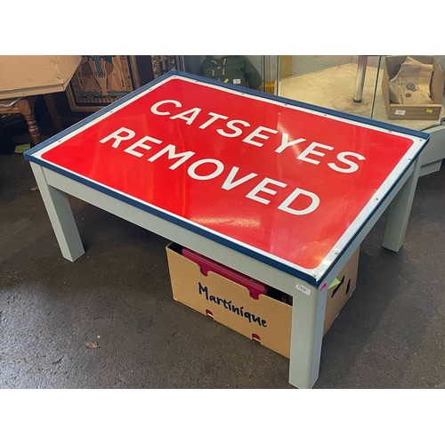 316 - A coffee table with inset metal sign 