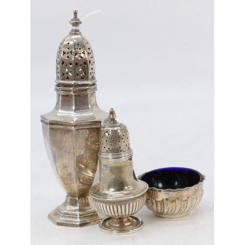 14 - A silver sugar caster (approx. 16cm tall), pepperette and a blue glass lined bowl. (approx. weight w... 