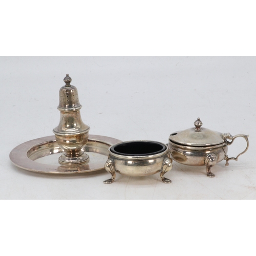 29 - A silver hallmarked matching cruet set with removable blue glass liners together with a small silver... 