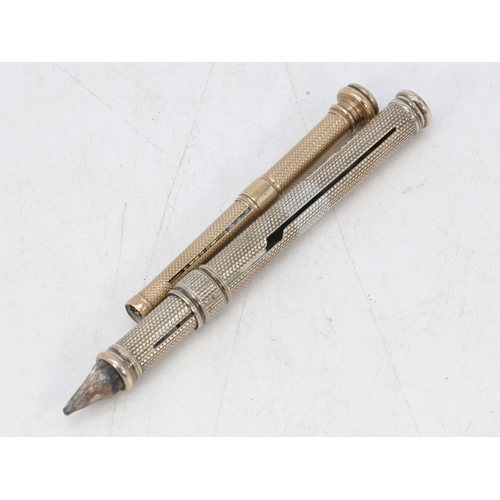 61 - S Mordan and Co silver propelling pencil together with a similar gilt propelling pencil with no make... 