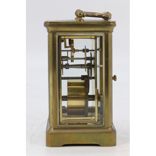 67 - A Castrell South Kensington brass cased carriage clock with visible escapement, appears over wound, ... 