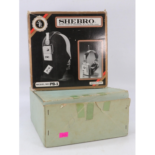 238 - Boxed vintage set of Shebro micro cassette headphones with FM radio, together with another set witho... 