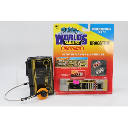 242 - Alba stereo portable cassette player CP6X together with a matchbox Worlds smallest drag strip, seale... 